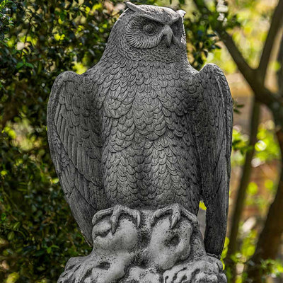Campania International August Owl Statue, set in the garden to add charm and character. The statue is shown in the Alpine Stone Patina.