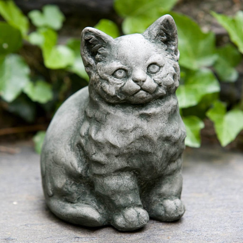 Campania International Kitty Statue, set in the garden to add charm and character. The statue is shown in the Alpine Stone Patina.