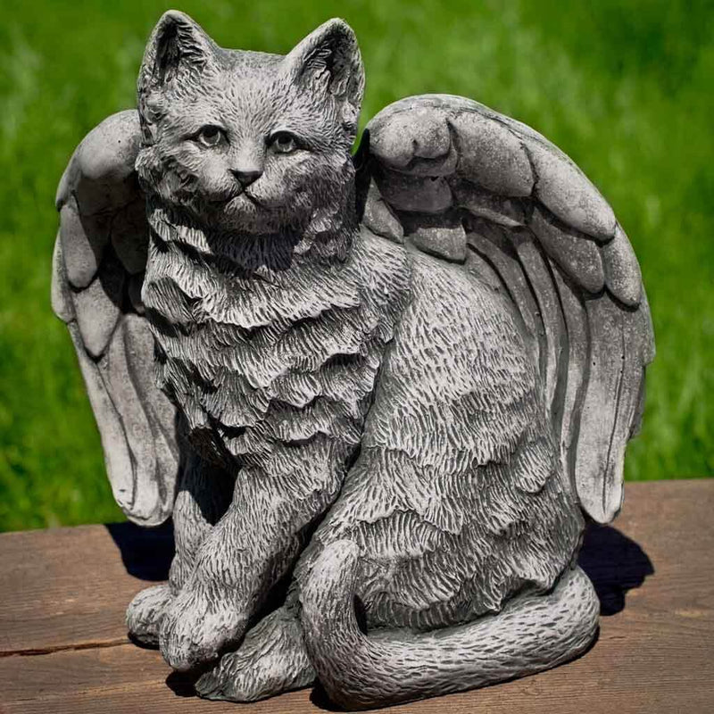 Campania International Angel Kitty Garden Statue, set in the garden to add charm and character. The statue is shown in the Alpine Stone Patina.