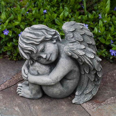 Campania International Evangeline Statue stained in the Alpine Stone  patina, the ideal color for this garden statue.