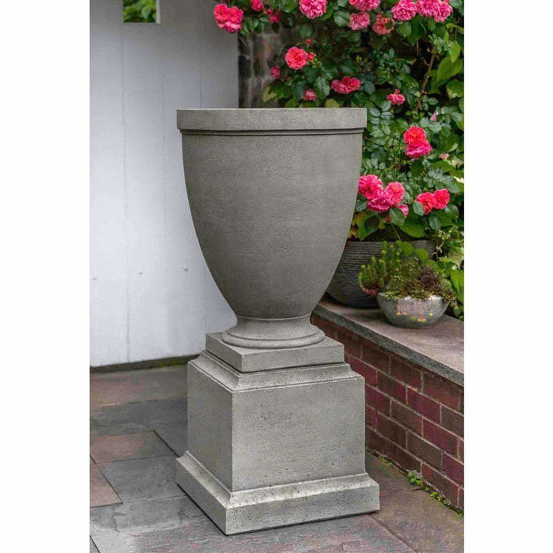 Campania International Capitol Hill Urn with Pedestal is shown in the Alpine Stone Patina. Made from cast stone.