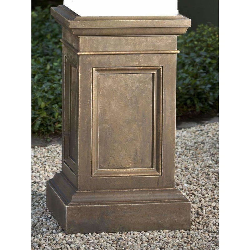 Campania International Coachhouse Pedestal, set in the garden elevate a statue or planter. The pedestal is shown in the Aged Limeston Patina.