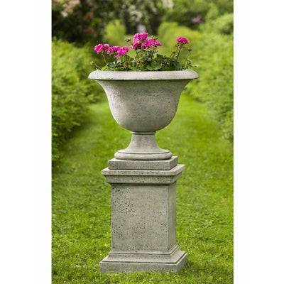 Campania International Fairfield Urn with Pedestal is shown in the Alpine Stone Patina. Made from cast stone.