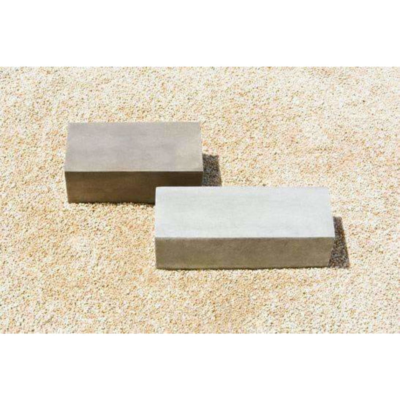 Campania International Low Rectangular Plinth, set in the garden elevate a statue or planter.