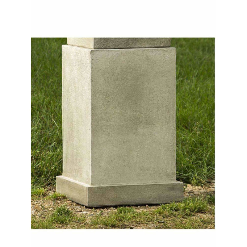 Campania International Savoy Pedestal, shown in hand-painted Verde, a light green-gray patina that works well against multiple colors in the landscape.