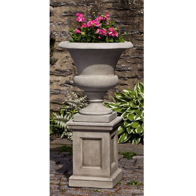 Campania International Wilton Urn with Barnett Pedestal is shown in the Alpine Stone Patina. Made from cast stone.