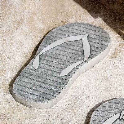 Campania International Left Flip Flop Stepping Stone stained in the Alpine Stone patina, the ideal color for this garden statue.
