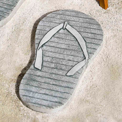 Campania International Right Flip Flop Stepping Stone stained in the Alpine Stone patina, the ideal color for this garden statue.