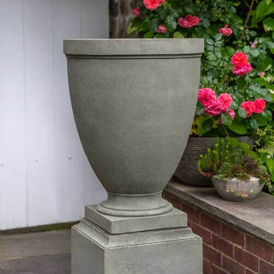 Campania International Capital Hill Urn is shown in the Alpine Stone Patina. Made from cast stone.