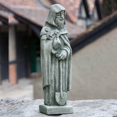 Campania International 14 inch St. Fiacre Statue placed in the garden. Religious garden statues, made of cast stone in a range of color options.