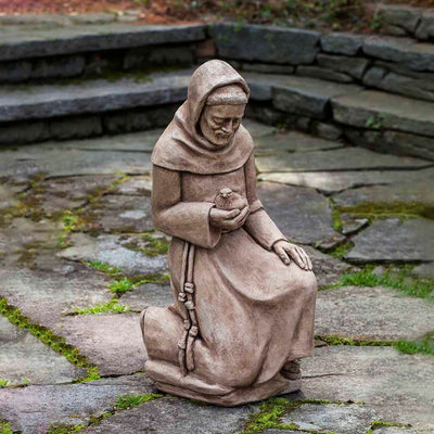 Campania International Kneeling St. Francis with Bird Statue stained in the Brownstone  patina, the ideal color for this garden statue.