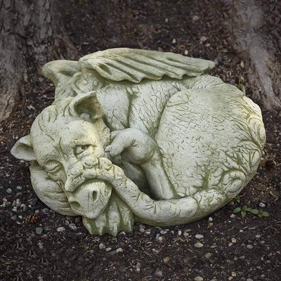 Campania International Peep Statue, set in the garden to add charm and character. The statue is shown in the English Moss Patina.