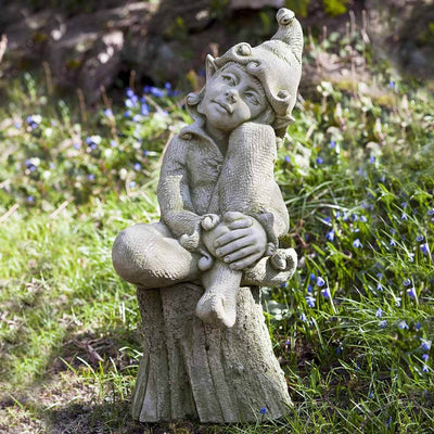 Campania International Jenny Statue, set in the garden to add charm and character. The statue is shown in the English Moss Patina.