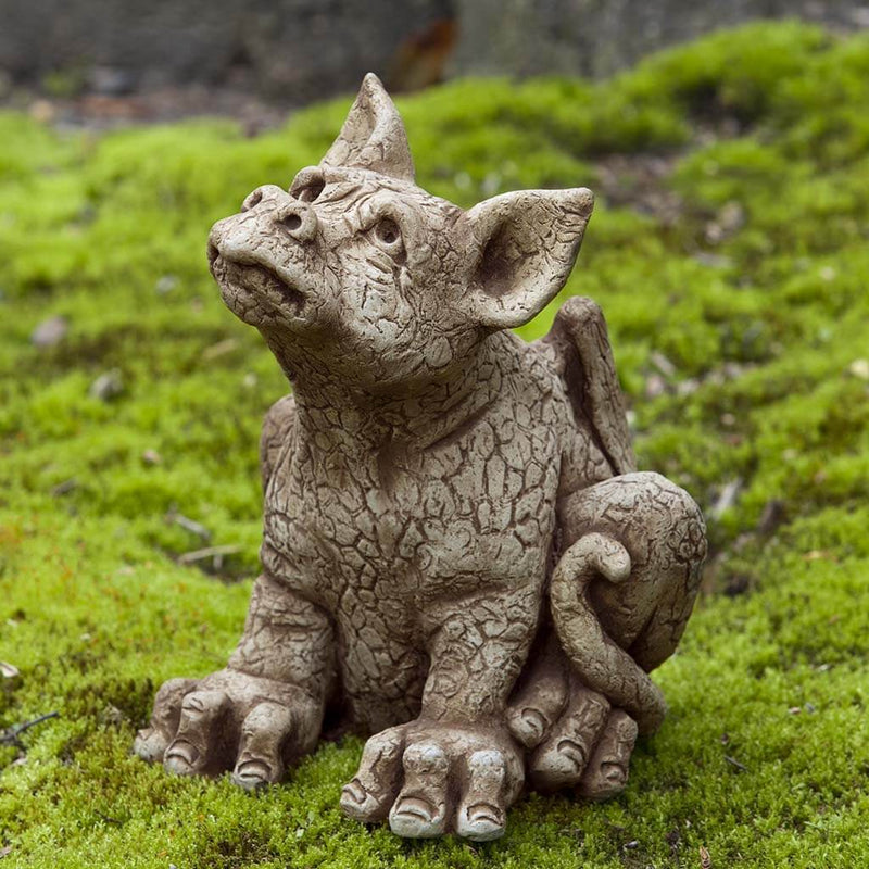 Campania International Paws Statue, set in the garden to add charm and character. The statue is shown in the Brownstone Patina.