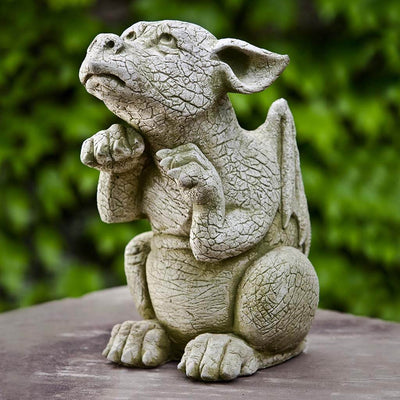 Campania International Scraps Statue, set in the garden to add charm and character. The statue is shown in the English Moss Patina.