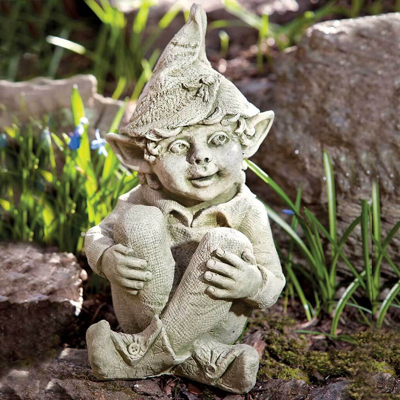 Campania International Aiden Statue, set in the garden to add charm and character. The statue is shown in the English Moss Patina.