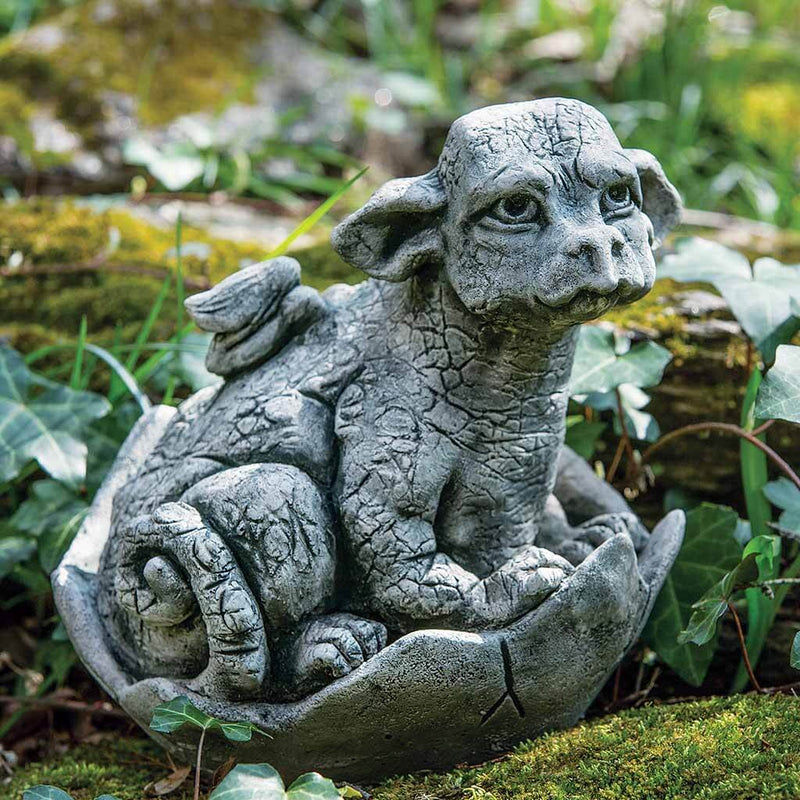 Campania International Whimper Statue, set in the garden to add charm and character. The statue is shown in the Alpine Stone Patina.