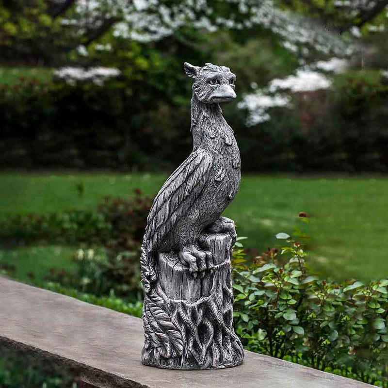 Campania International Phoenix Statue, set in the garden to add charm and character. The statue is shown in the Alpine Stone Patina.