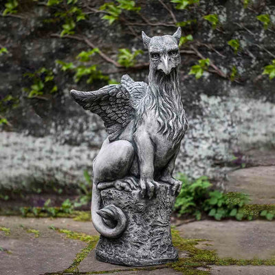 Campania International Herald Statue, set in the garden to add charm and character. The statue is shown in the Alpine Stone Patina.