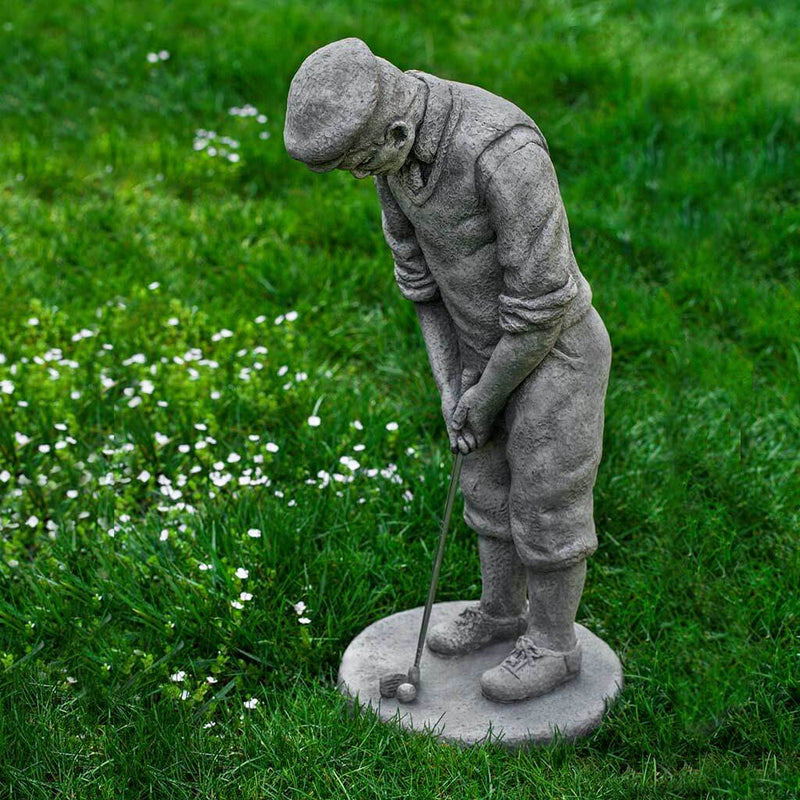 Campania International Classic Golfer Statue, set in the garden to add charm and character. The statue is shown in the Greystone Patina.