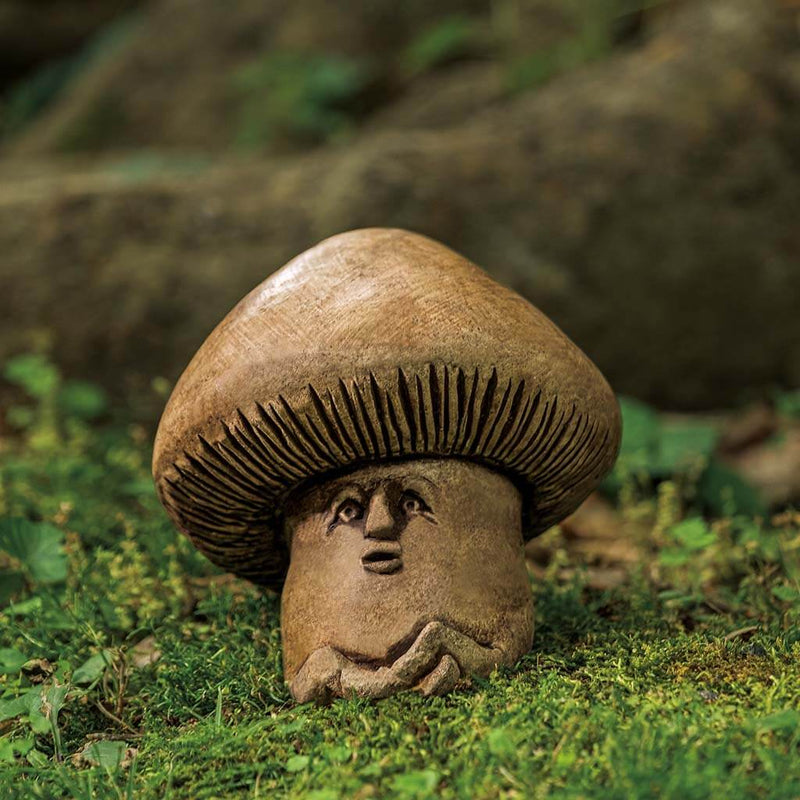 Campania International Shroom Statue, set in the garden to add charm and character. The statue is shown in the Brownstone Patina.